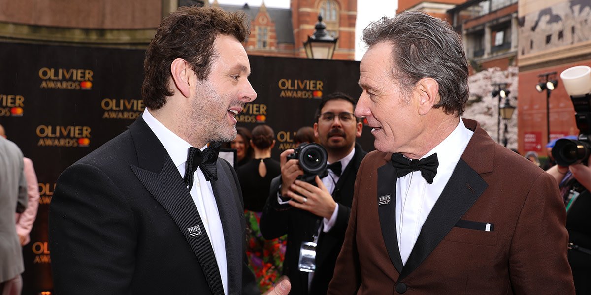 Michael Sheen (wearing Chester Barrie) and Bryan Cranston on the Olivier Awards 2018 with Mastercard red carpet (Photo: Pamela Raith)