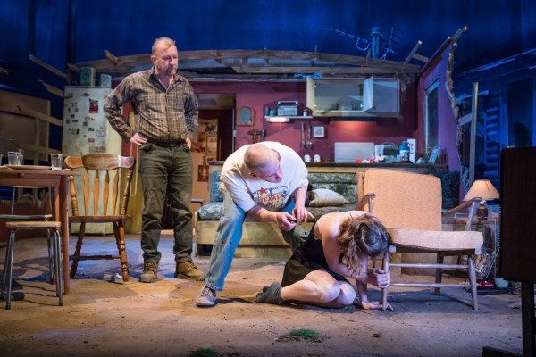 Steffan Rhodri as Ansel Smith, Adam Gillen as Chris Smith and Sophie Cookson as Dottie - Killer Joe at Trafalgar Studios - Photographer Marc Brenner