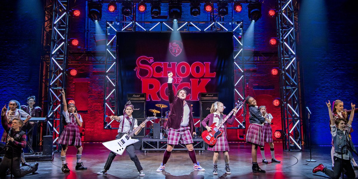 Craig Gallivan and the kids of School Of Rock. Photo credit Tristram Kenton