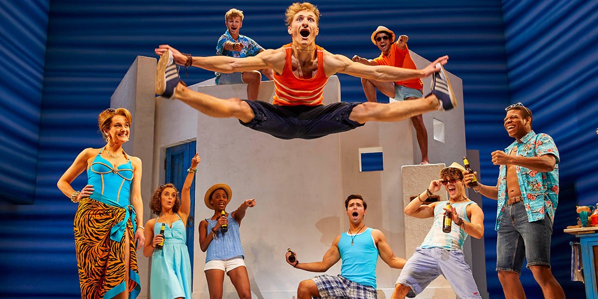 Danny Nattrass as Pepper (front centre) with the cast of MAMMA MIA_ Credit Brinkhoff & Mögenburg