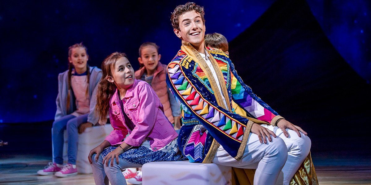 Jac Yarrow And Jason Donovan: Jac Yarrow (Joseph) and the company of Joseph and the Amazing Technicolor Dreamcoat. Photo by Tristram Kenton