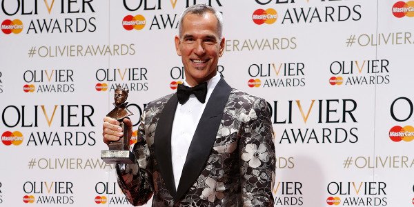Jerry Mitchell collecting Best Costume Design on behalf of Gregg Barnes for Kinky Boots at the Olivier Awards 2016