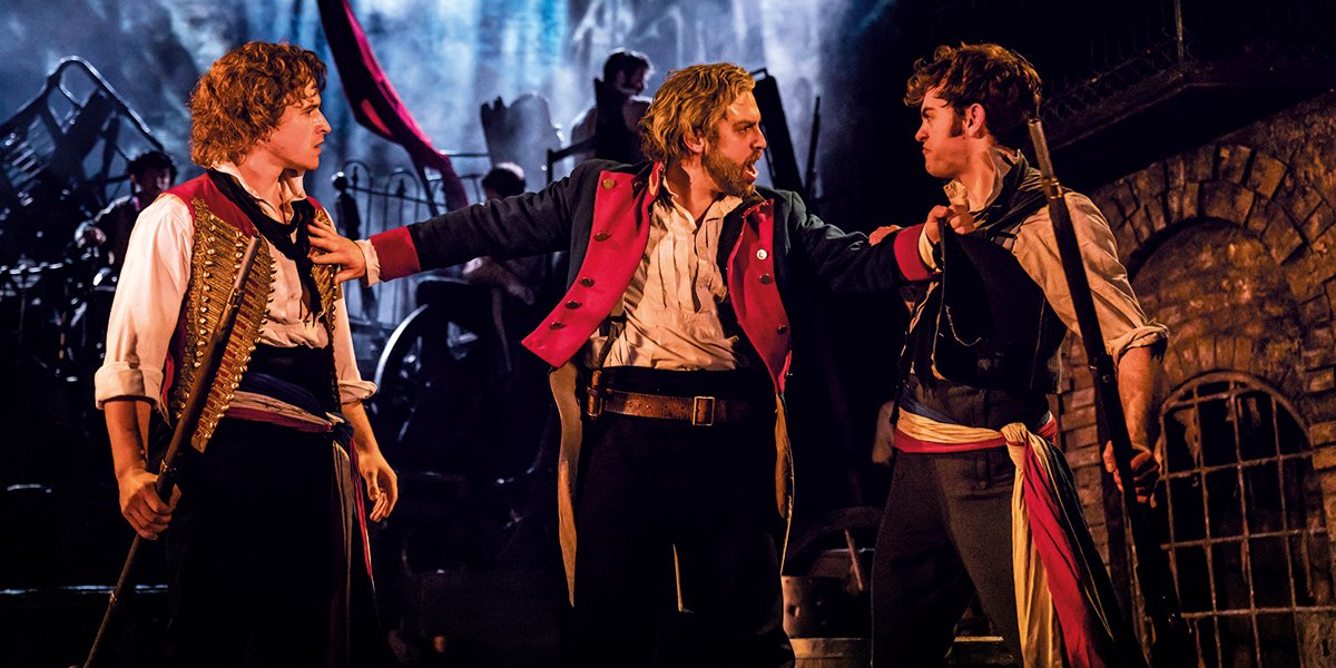 Ashley Gilmour as Enjolras, Jon Robyns as Jean Valjean and Harry Apps as Marius in Les Mis. Photo by Michael Le Poer Trench.