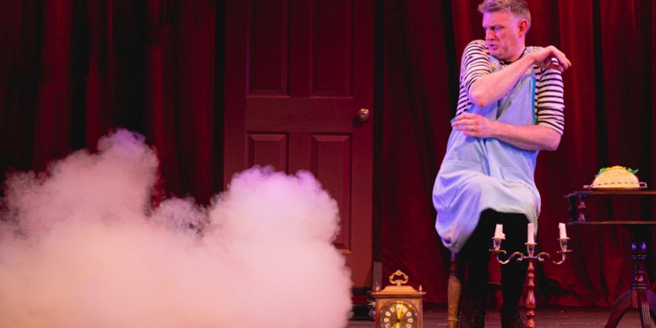 Smoke rises and a man leans away